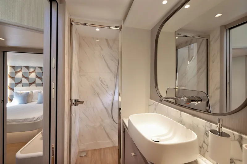 Slide: The Image of Luxurious bathroom interior on Absolute Navetta 62 yacht, featuring modern sink and marble accents. - 44