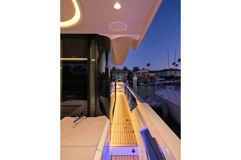 Slide: The Image of Luxurious Absolute Navetta 62 yacht deck at sunset, showcasing modern design and ambient lighting. - 29