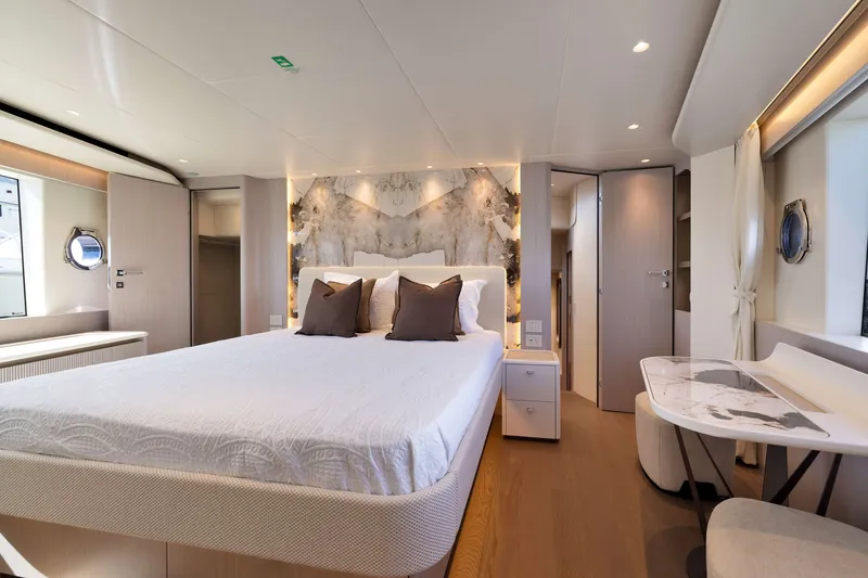 Slide: The Image of Luxurious bedroom interior of 2027 Absolute Navetta 62 yacht with elegant decor and modern furnishings. - 35
