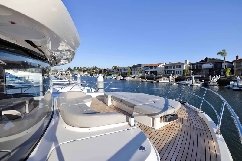 Slide: The Image of Luxurious Absolute Navetta 62 yacht, 2027 model, docked in a scenic marina. - 56