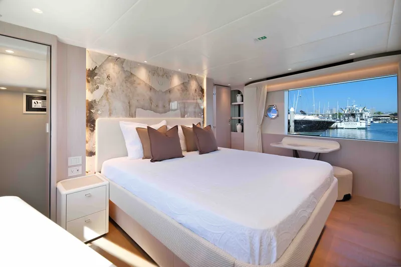 Slide: The Image of Luxurious bedroom interior of 2027 Absolute Navetta 62 yacht with marina view. - 19