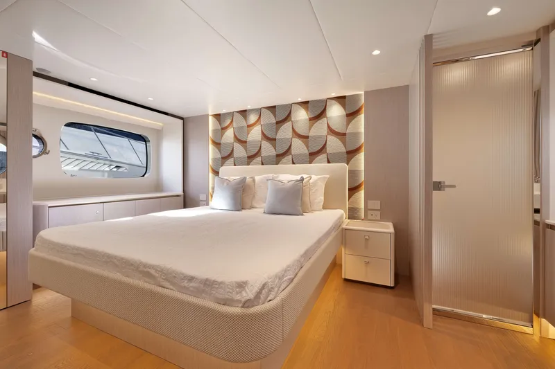 Slide: The Image of Luxurious bedroom interior on Absolute Navetta 62 yacht, 2027 model, featuring modern design. - 45