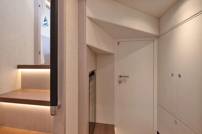 Slide: The Image of Modern interior of Absolute Navetta 62 yacht, featuring sleek design and ambient lighting, 2027 model. - 40