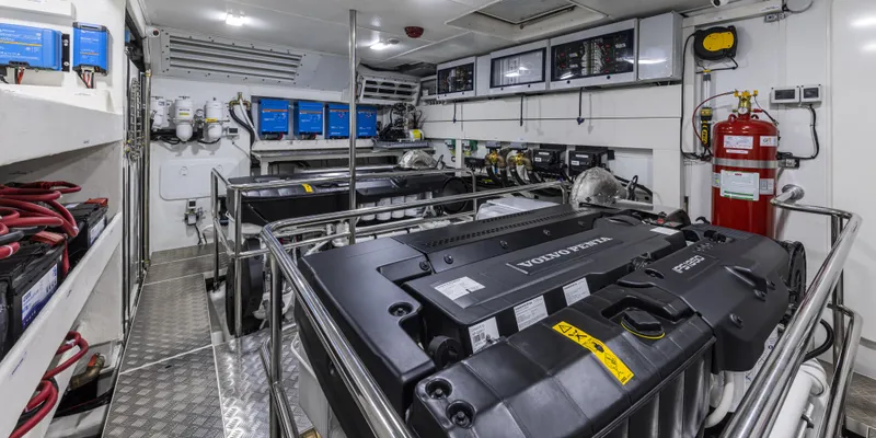 Slide: The Image of Engine room of 2025 Absolute NAVETTA 75 yacht, featuring advanced machinery and safety equipment. - 35