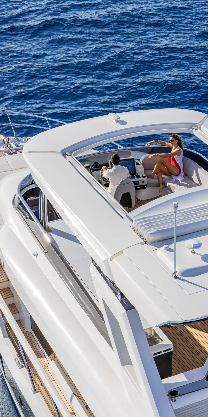 Slide: The Image of Luxury Absolute NAVETTA 75 yacht cruising on open sea, 2025 model. - 5