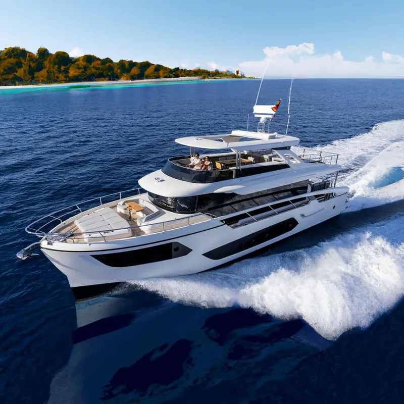 Slide: The Image of Luxurious 2025 Absolute NAVETTA 75 yacht cruising on open sea. - 0