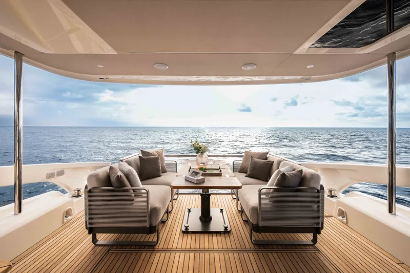 Slide: The Image of Luxuriöser Außenbereich der Absolute 50 Navetta von 2027 mit stilvollen Sitzgelegenheiten und Meerblick. - 6