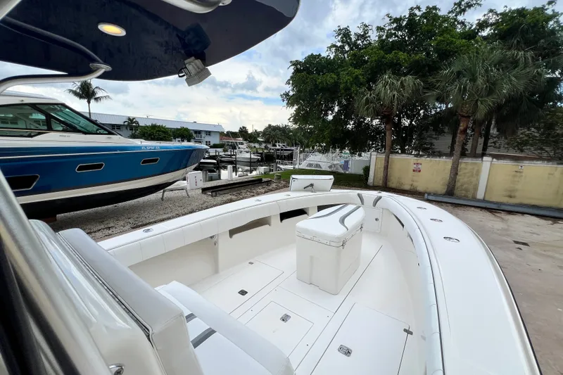 Slide: The Image of 2007 SeaVee 340B Open boat docked, featuring spacious deck and seating area. - 61