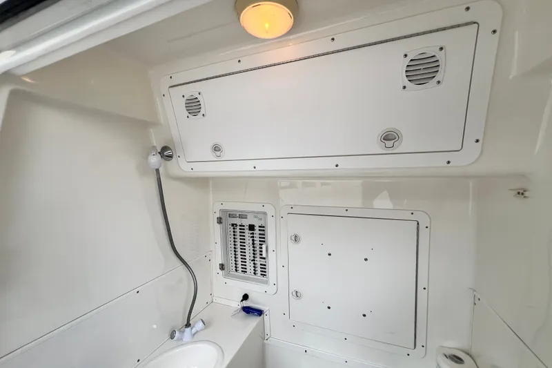 Slide: The Image of Interior of 2007 SeaVee 340B Open boat with control panel and showerhead. - 82