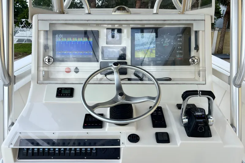 Slide: The Image of 2007 SeaVee 340B Open boat dashboard with steering wheel and navigation displays. - 31