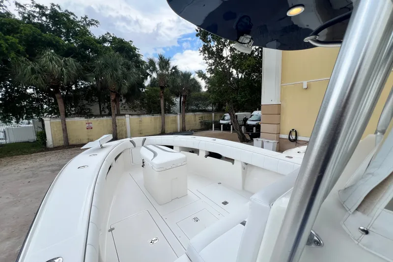 Slide: The Image of 2007 SeaVee 340B Open boat with spacious deck and seating, surrounded by palm trees. - 73