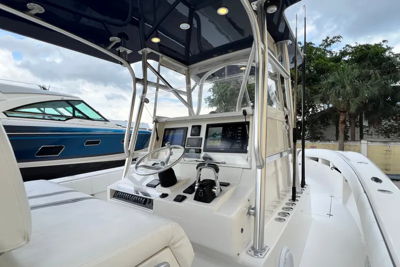 Slide: The Image of 2007 SeaVee 340B Open boat cockpit with steering wheel and navigation screens. - 46