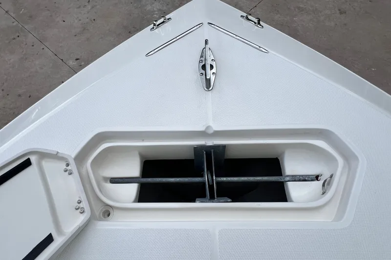 Slide: The Image of Bow anchor compartment of 2007 SeaVee 340B Open boat, featuring a secured anchor. - 67
