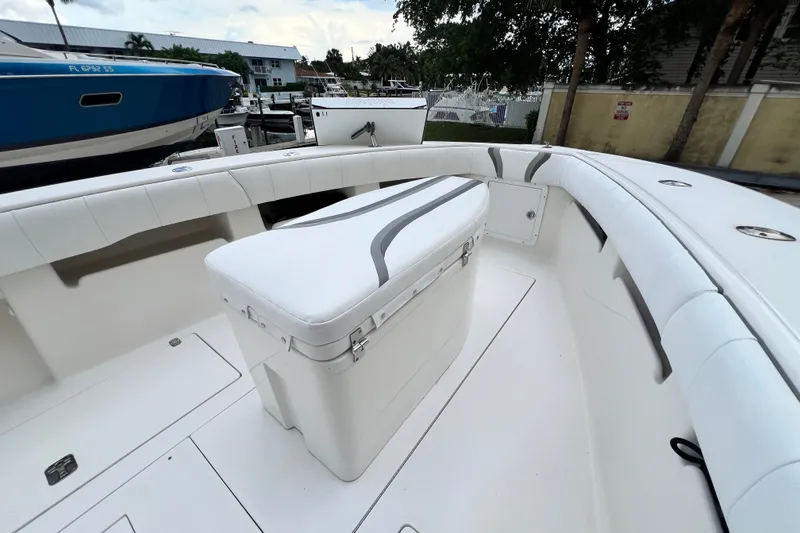Slide: The Image of 2007 SeaVee 340B Open boat interior with white seating and storage. - 63