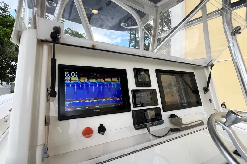Slide: The Image of Console of 2007 SeaVee 340B Open with advanced navigation and sonar displays. - 49