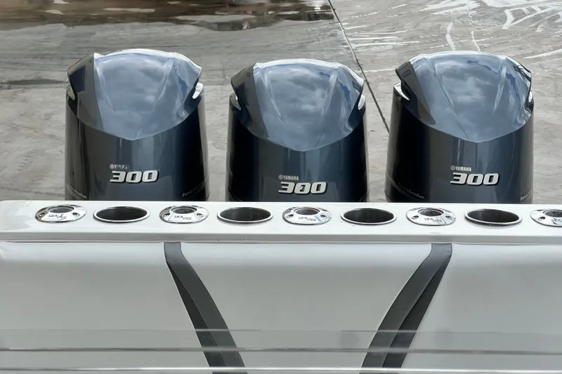 Slide: The Image of Triple Yamaha 300 engines on a 2007 SeaVee 340B Open boat. - 99
