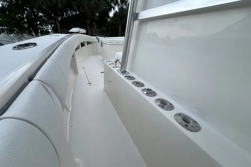 Slide: The Image of 2007 SeaVee 340B Open boat interior with rod holders and cushioned seating. - 72