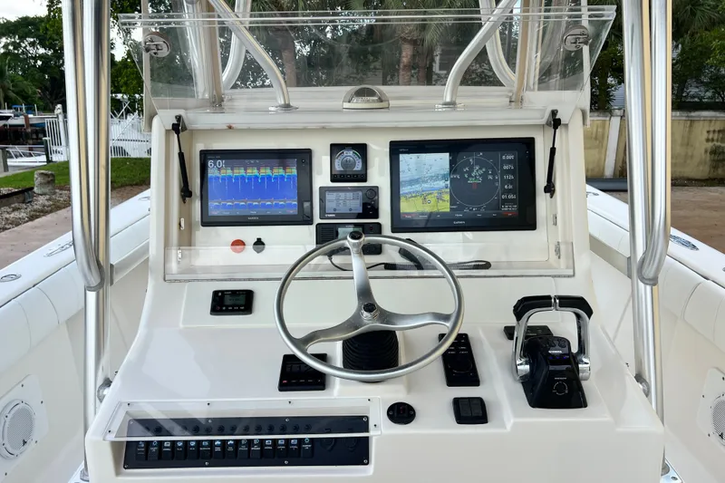 Slide: The Image of 2007 SeaVee 340B Open boat dashboard with navigation screens and steering wheel. - 33