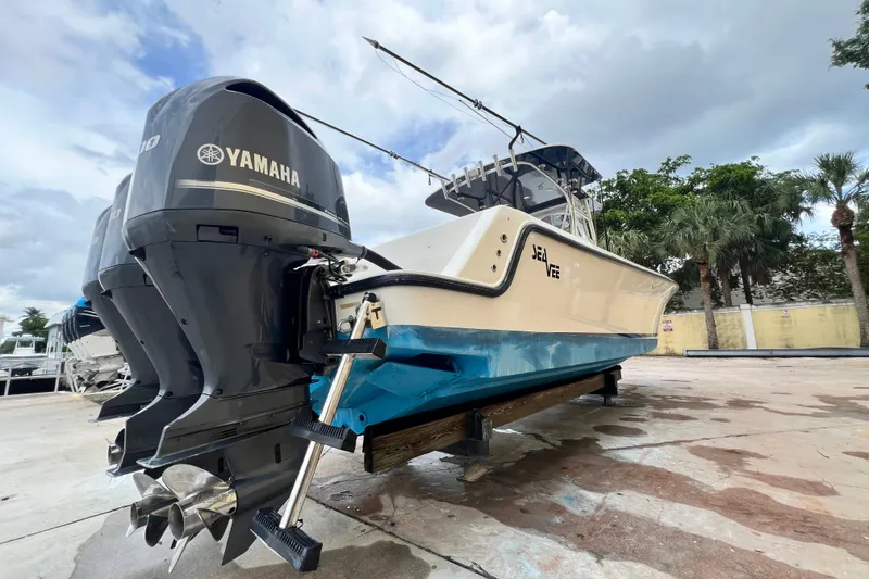 Slide: The Image of 2007 SeaVee 340B Open boat with Yamaha engines on a trailer, under cloudy sky. - 3