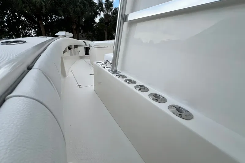 Slide: The Image of 2007 SeaVee 340B Open boat interior with rod holders and sleek white design. - 69