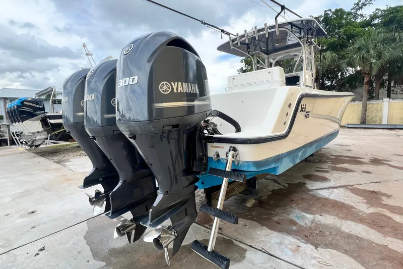 Slide: The Image of 2007 SeaVee 340B Open boat with triple Yamaha 300 engines, docked outdoors. - 6