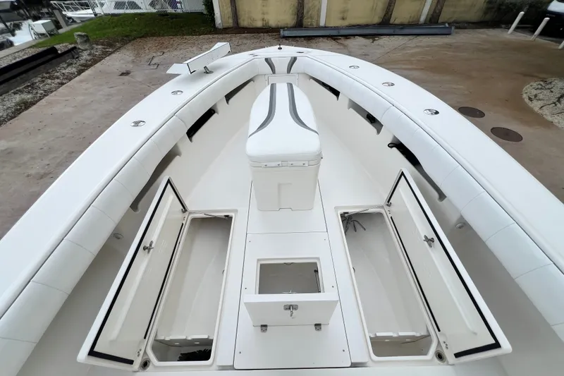 Slide: The Image of 2007 SeaVee 340B Open boat deck with storage compartments open, showcasing spacious design. - 94