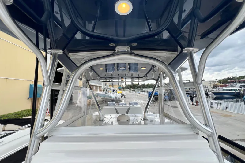 Slide: The Image of 2007 SeaVee 340B Open boat with T-top and marina background. - 96
