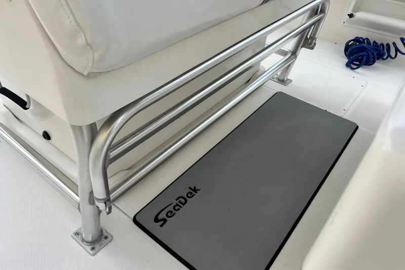 Slide: The Image of 2007 SeaVee 340B Open boat interior with SeaDek mat and metal railing. - 102