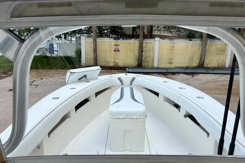 Slide: The Image of 2007 SeaVee 340B Open boat interior with white seating and storage compartments. - 53