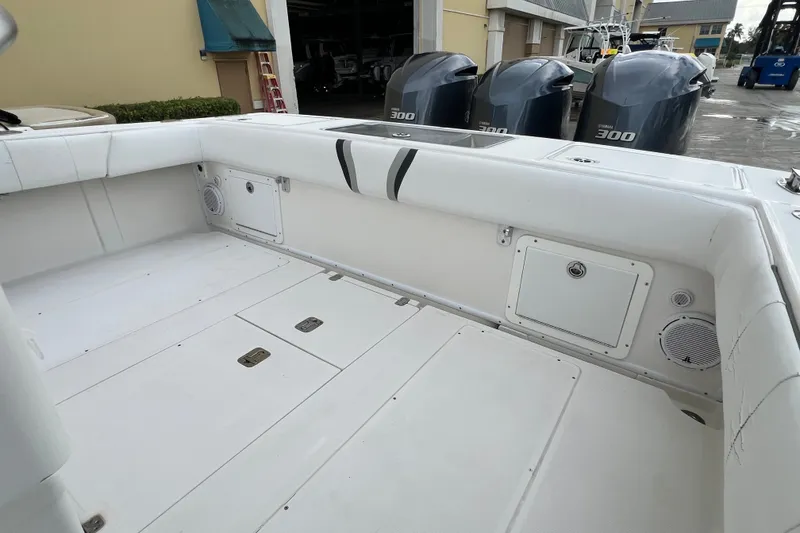 Slide: The Image of 2007 SeaVee 340B Open boat deck with Yamaha 300 engines in marina setting. - 105