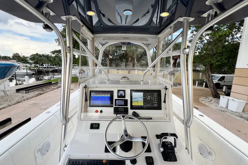 Slide: The Image of 2007 SeaVee 340B Open boat cockpit with advanced navigation systems and steering wheel. - 55