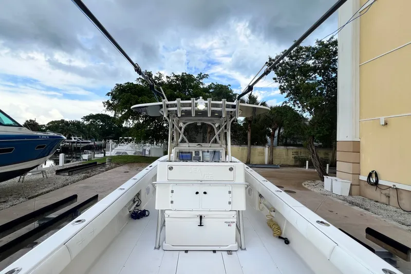 Slide: The Image of 2007 SeaVee 340B Open boat docked, showcasing spacious deck and center console. - 27