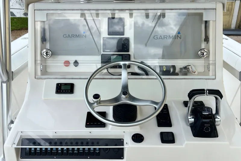 Slide: The Image of 2007 SeaVee 340B Open boat dashboard with Garmin navigation and steering wheel. - 30