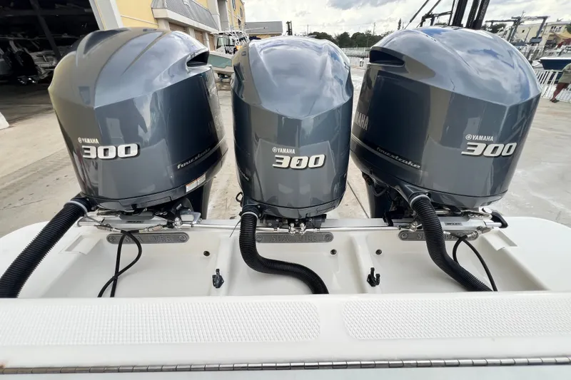 Slide: The Image of Triple Yamaha 300 engines on a 2007 SeaVee 340B Open boat. - 113
