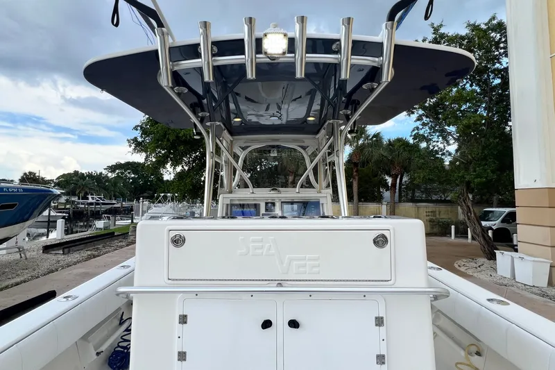 Slide: The Image of 2007 SeaVee 340B Open boat with T-top and rod holders, docked at marina. - 41