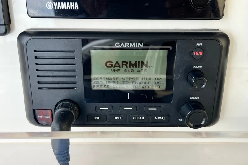 Slide: The Image of Garmin VHF 210 AIS radio on 2007 SeaVee 340B Open boat dashboard. - 38