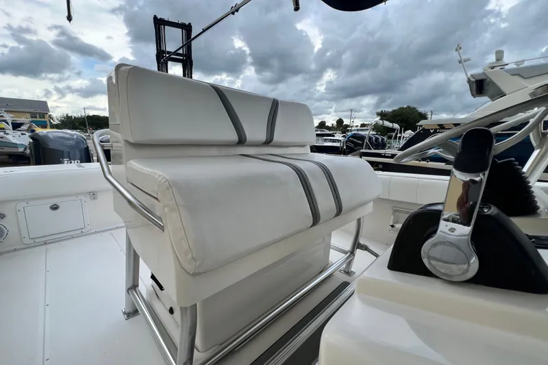 Slide: The Image of 2007 SeaVee 340B Open boat interior with cushioned seating and control panel. - 101