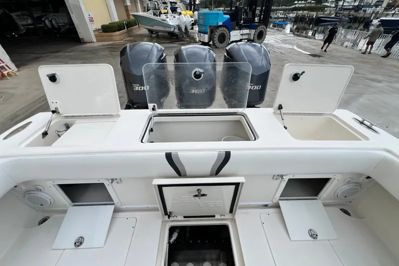 Slide: The Image of 2007 SeaVee 340B Open boat with triple 300 horsepower engines, docked at a marina. - 111