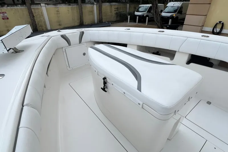Slide: The Image of 2007 SeaVee 340B Open boat interior with cushioned seating and storage compartment. - 75