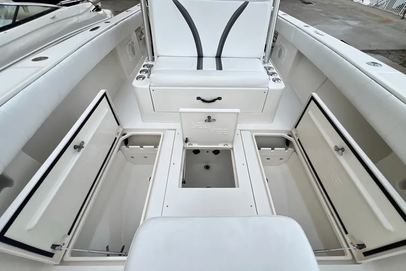 Slide: The Image of 2007 SeaVee 340B Open boat interior with open storage compartments and seating. - 88