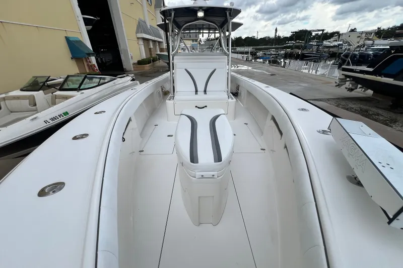Slide: The Image of 2007 SeaVee 340B Open boat docked, showcasing spacious deck and seating area. - 79