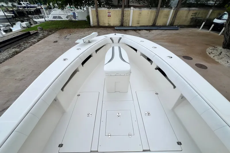 Slide: The Image of 2007 SeaVee 340B Open boat deck with white seating and storage compartments. - 86