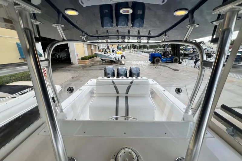 Slide: The Image of 2007 SeaVee 340B Open boat with triple engines, docked at a marina. - 97