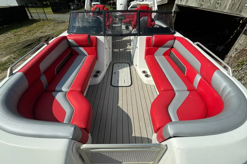 Slide: The Image of 2021 Amara pontoon boat with red and gray seating, spacious deck layout. - 8