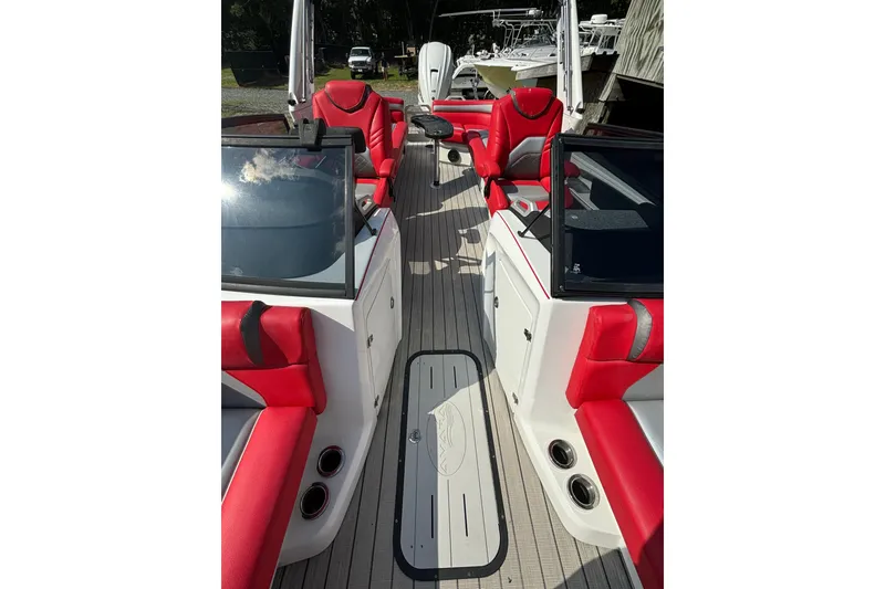 Slide: The Image of 2021 Amara pontoon boat interior with red seating and sleek design. - 9
