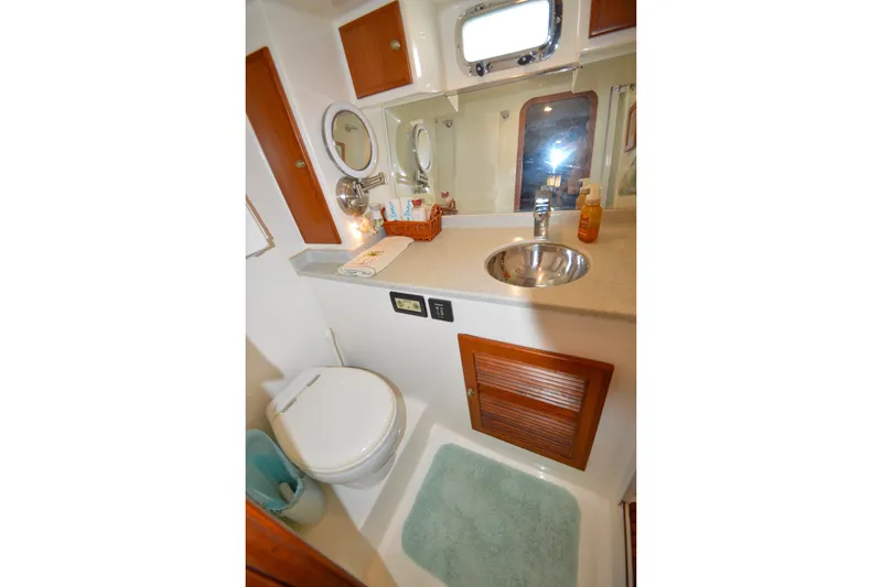 Slide: The Image of Bathroom interior of 2012 North Pacific Yachts 43, featuring sink and toilet. - 80