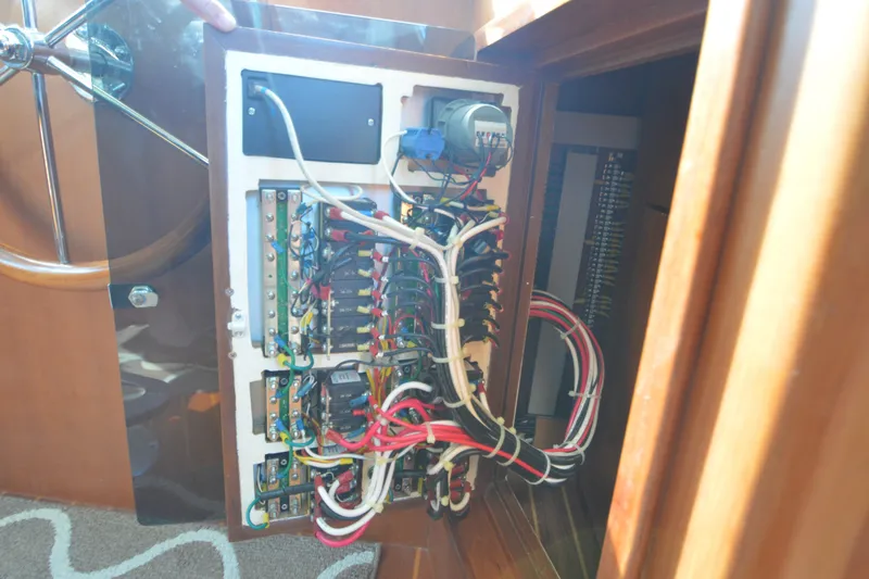 Slide: The Image of Electrical panel of a 2012 North Pacific Yachts 43, showcasing intricate wiring and components. - 68