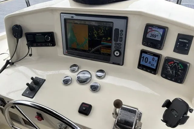 Slide: The Image of Helm of 2012 North Pacific Yachts 43 with navigation and control instruments. - 22