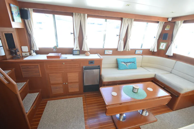 Slide: The Image of Luxurious interior of 2012 North Pacific Yachts 43 with elegant wood finish and cozy seating. - 4