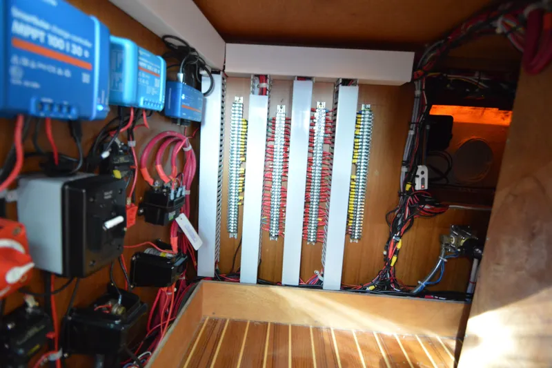 Slide: The Image of Electrical panel inside a 2012 North Pacific Yachts 43, showcasing wiring and components. - 71